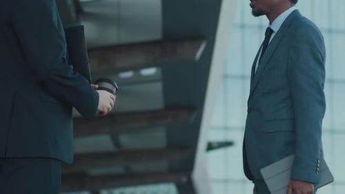African American Man in Business Suit Shaking Hands with his Colleague