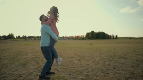 Woman Runs to Man Who Lifts Her in Air