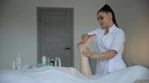 Woman Receiving Foot Massage at Spa