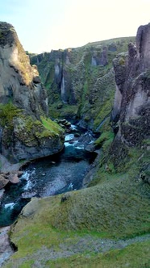 Majestic Fjadrargljufur Canyon Showcases Stunning Icelandic Landscapes and Serene Waters
