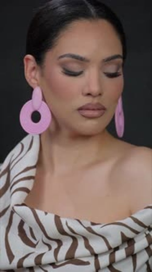 Glamorous Woman Posing With Bold Statement Earrings
