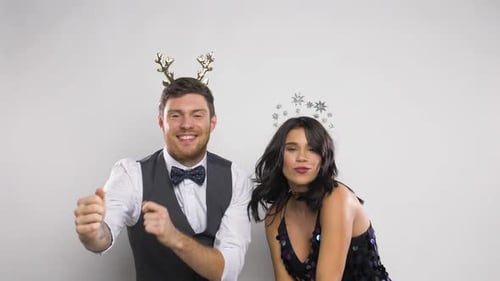 Festive Man and Woman Dancing in Studio
