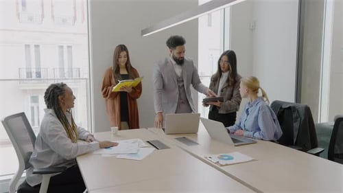 A Diverse Team Collaborates in a Bright Creative Office to Strategize Their Future