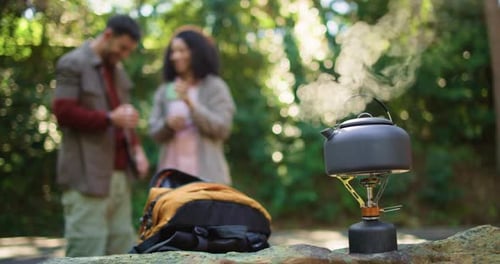 Travel, drink and kettle with couple in nature for brewing coffee, trekking rest stop and woods