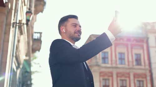 Close Up of Caucasian Bearded Businessman Wearing Headphones and Started His Business Meeting at the