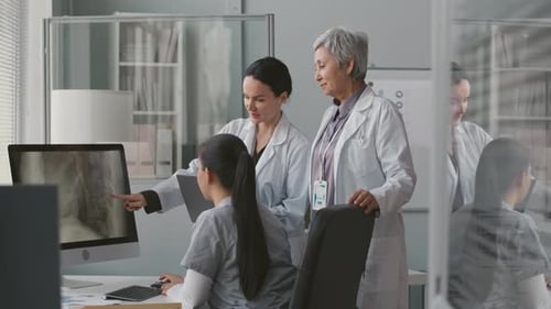 Medical Team Reviewing Patient X-Ray Together