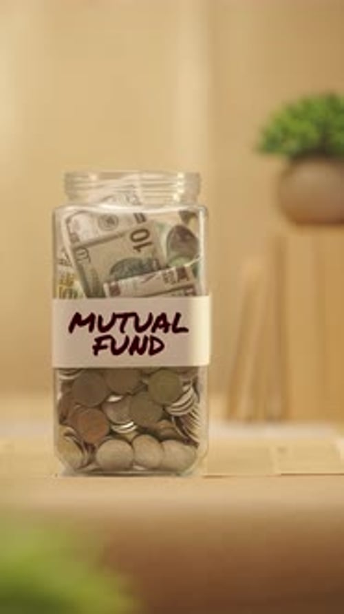 Depositing Money into a Mutual Fund Savings Jar