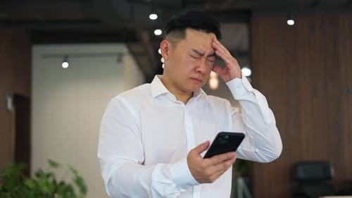 Sick Office Manager Complaining on Severe Headache While Using Mobile Phone