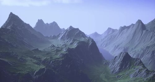 Majestic Mountain Range Under Soft Sunlight During Early Morning Hours