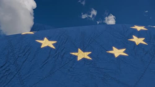 Waving European Union Flag with Sky Background