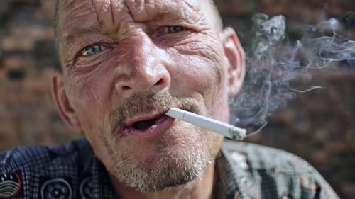 Aged Man Smoking Cigarette