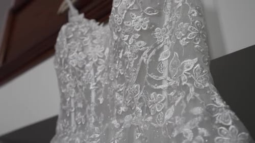Elegant Floral Lace Wedding Gown Hanging