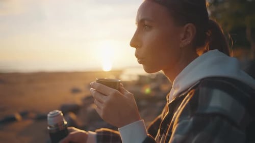 Camper Woman Drinking Tea on Sea Beach Portrait Middle Aged Female Tourist Enjoying Hot Beverage