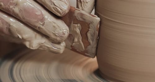 Crafting Clay Into Pottery on a Wheel
