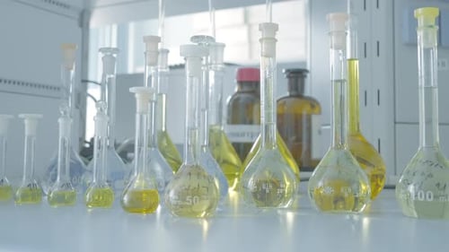 Laboratory Glassware with Yellow Liquids for Science