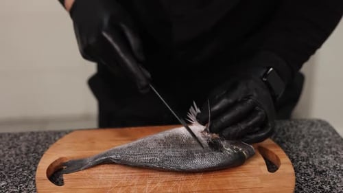 chef prepares a delicious fish dish. Close-up