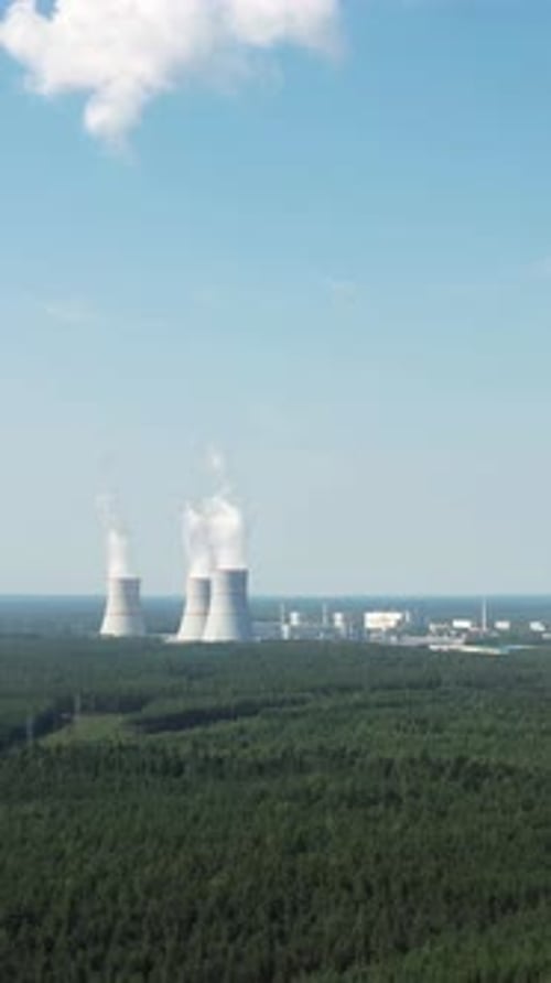 Aerial View on Smoking Cooling Towers at Power Plant Vertical