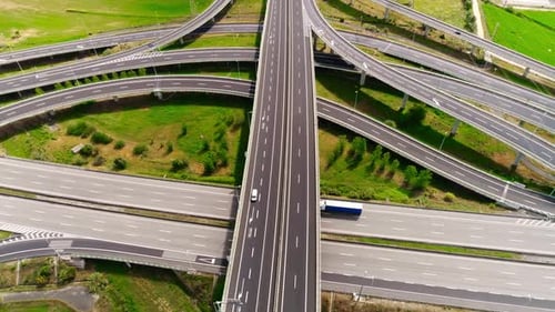 Aerial View of Highway Interchange with Moving Traffic