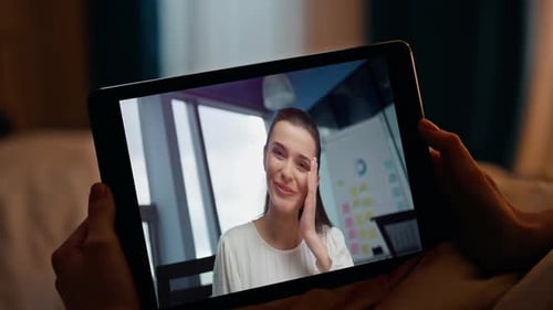 Businesswoman on Video Call Using Tablet at Home