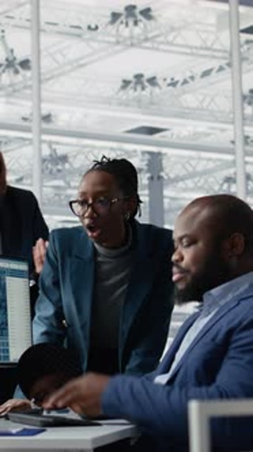 Vertical Video Optimizing Production Microchip and Multiracial Men with Women in Factory