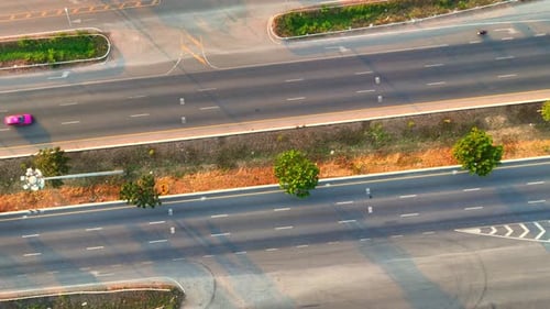Aerial top view of the highway at sunset
