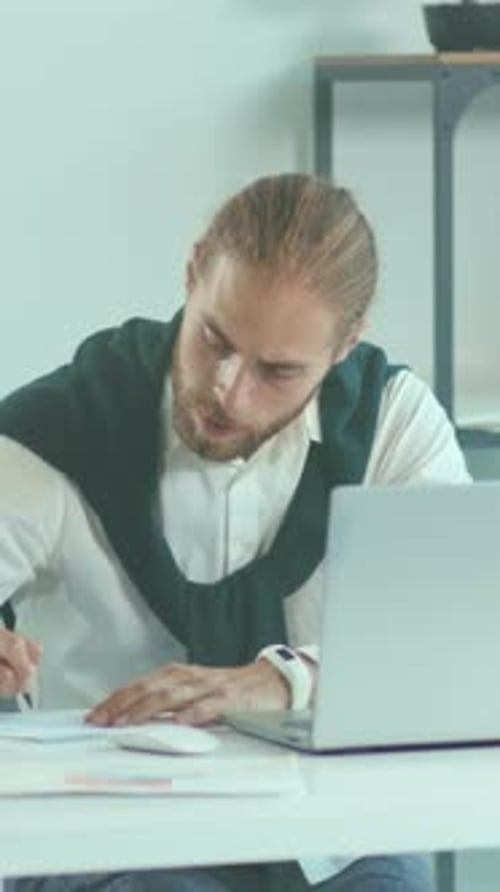 Young Man Working From Home at Desk