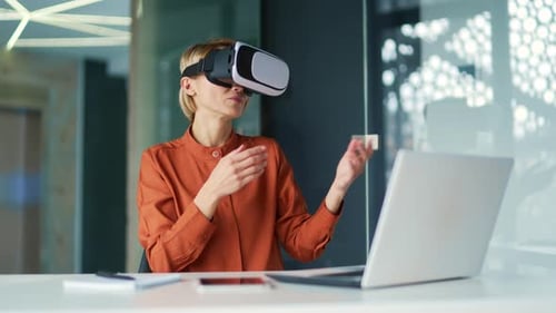 Woman Experiences Virtual Reality in Bright Office Setting