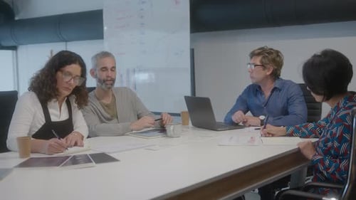 CEO Holding Business Meeting with Colleagues in the Office