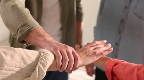 Diverse Group Stacking Hands in Unity and Support