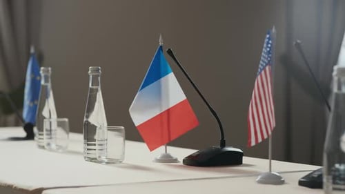Flags of Countries on Table at Conference Meeting
