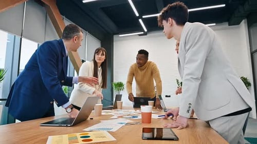 Multiracial group of people at business meeting in an office, discussing business affairs with each