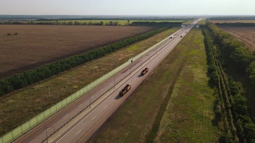Semi Trucks with Cargo Trailer are Moving on the Highway