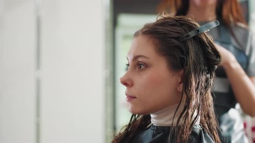 Woman Gets Hair Styled in Hair Salon