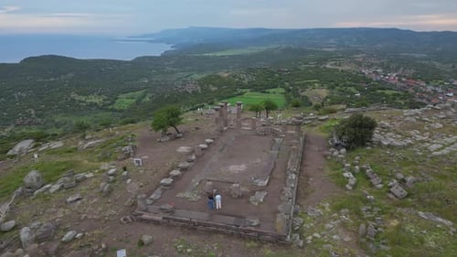 Drone View of Ancient Assos Site on a Hill with Sea in Background Turkey
