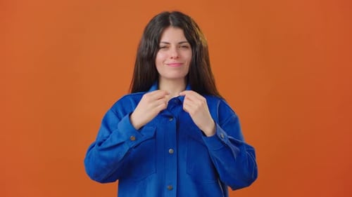 Smiling Brunette Woman Makes Hearts and Finger Hearts