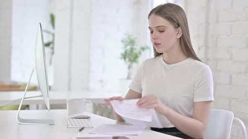 Young Woman Working at Desk with Computer