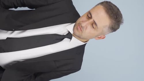 Man in Suit Looking at Camera