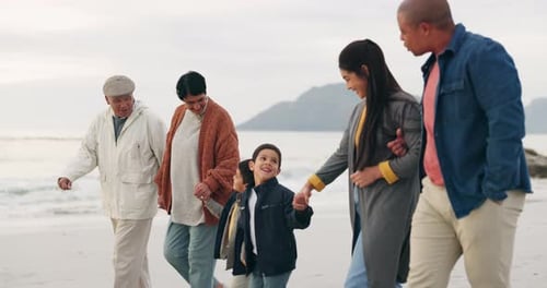 Big family, walk on beach and hand holding, generations and travel by the ocean