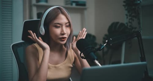 Woman Speaking Into Microphone for Broadcast