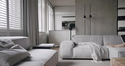 Woman Rests at Modern Home