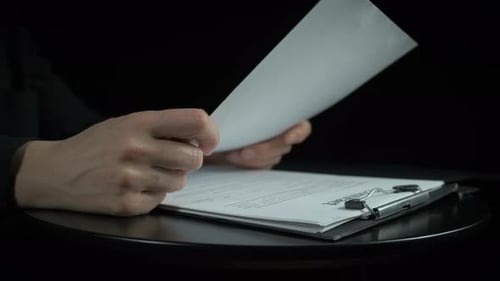 Hands Reviewing Contract Documents, Giving Thumbs Up