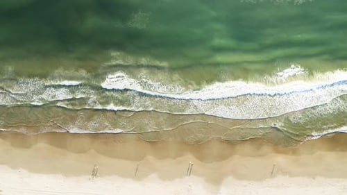 Beautiful drone cinematic top view of a brazilian beach with white sand and emerald clear water at s