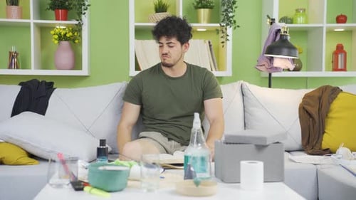 Lazy Man on Messy Couch Wakes Up