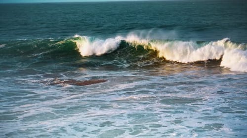 White sea waves rolling on seashore in sunny morning slow motion tropical seascape
