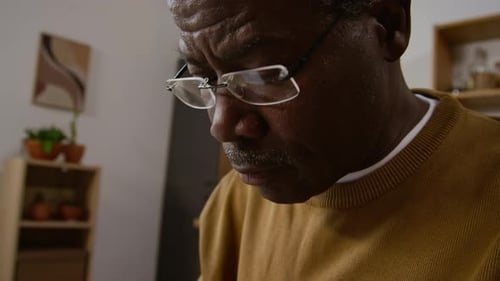 Senior man rubbing his temples and eyes