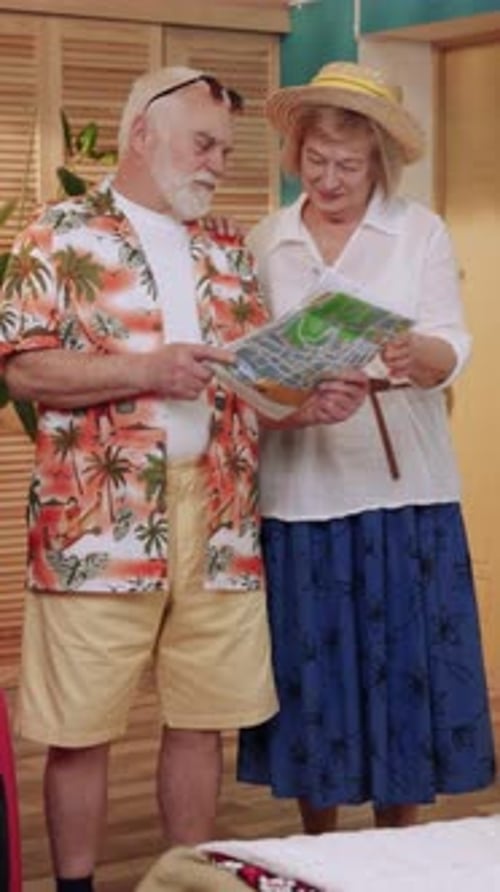 Senior Couple Plans Vacation Using a Map