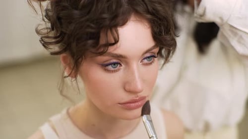 Woman Having Makeup Applied With Brush