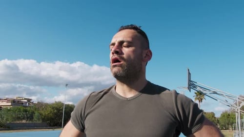 Man Breathes Pure Air After Intensive Training Outdoors