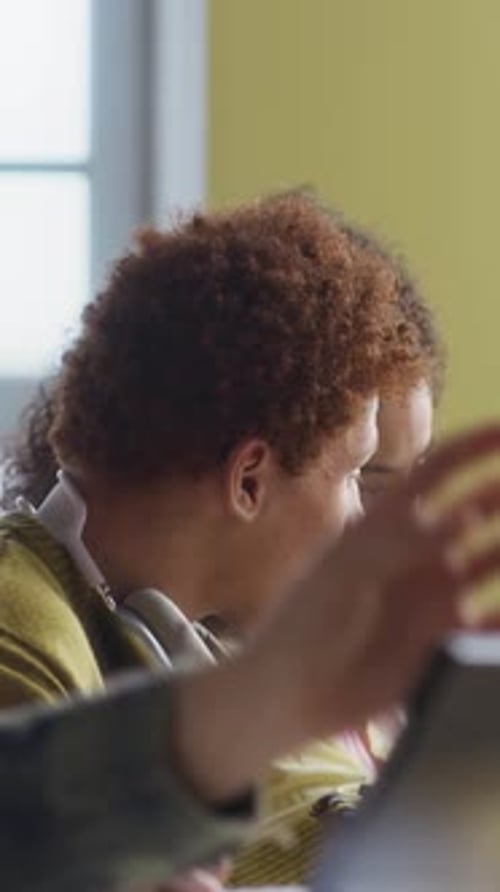 Students Collaborating at School on a Tablet
