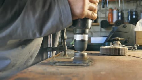 Hands of Mechanic Hold Tool During Operation Man Works in His Garage or Workshop Worker Processes